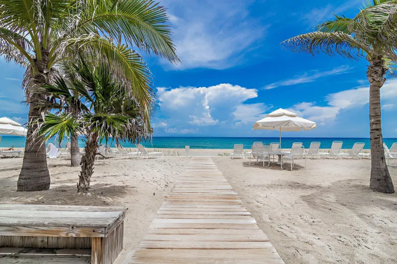 Private Beach with Chairs and Umbrellas