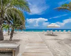 Private Beach with Chairs and Umbrellas